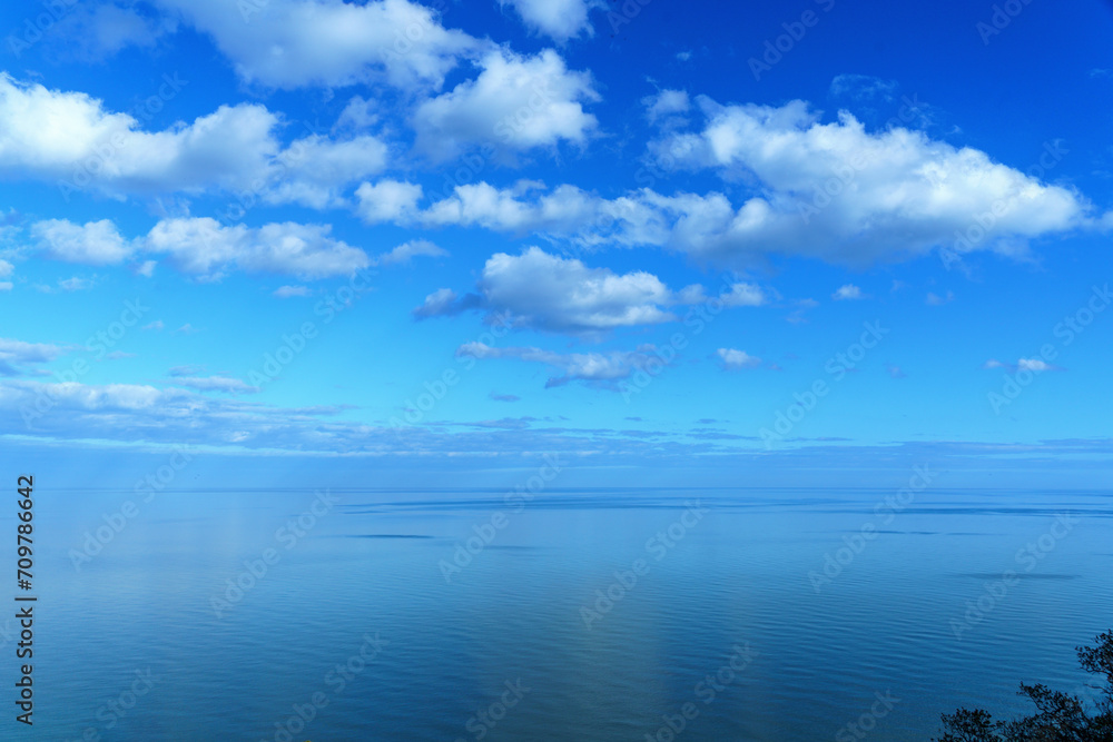 seaside ocean landscape clouded with a distant blue horizon