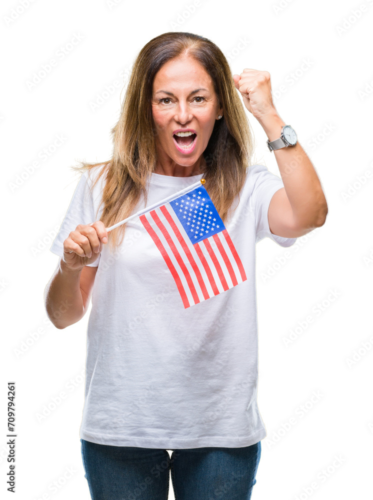 Middle age hispanic woman holding flag of United States of America over isolated background annoyed and frustrated shouting with anger, crazy and yelling with raised hand, anger concept Middle age hispanic woman holding flag of United States of America over isolated background annoyed and frustrated shouting with anger, crazy and yelling with raised hand, anger concept