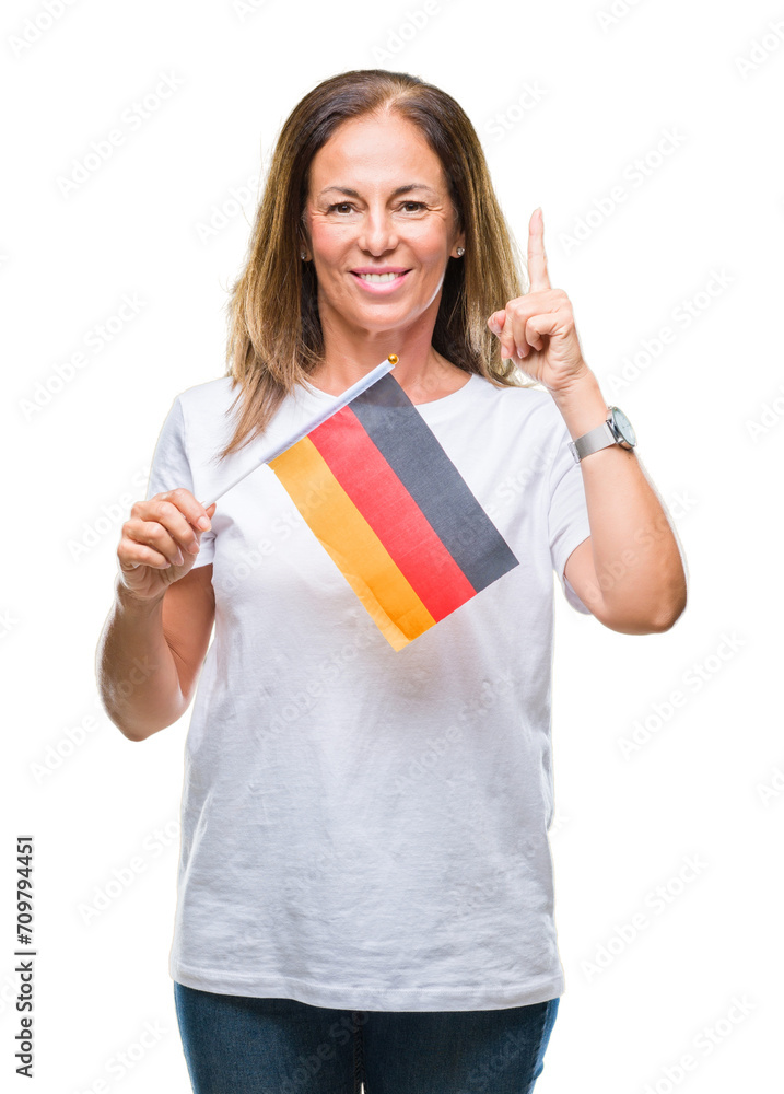 Middle age hispanic woman holding flag of Germany over isolated background surprised with an idea or question pointing finger with happy face, number one Middle age hispanic woman holding flag of Germany over isolated background surprised with an idea or question pointing finger with happy face, number one