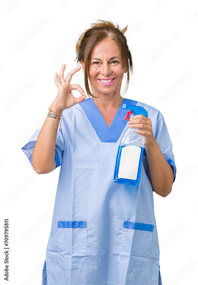 Middle age brunette cleaner woman wearing housework uniform over isolated background doing ok sign with fingers, excellent symbol Middle age brunette cleaner woman wearing housework uniform over isolated background doing ok sign with fingers, excellent symbol