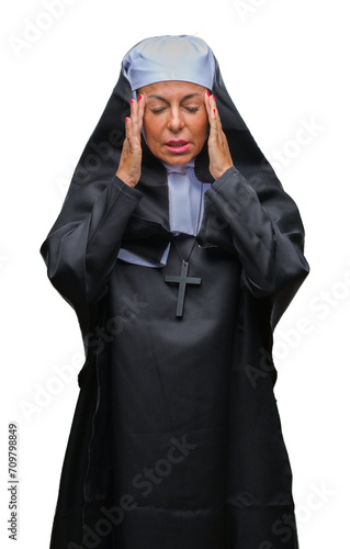 Middle age senior christian catholic nun woman over isolated background with hand on head for pain in head because stress. Suffering migraine.