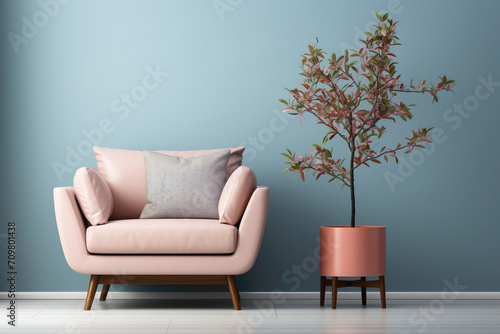 Infuse tranquility into your space with a gentle color single sofa chair, complemented by a charming little plant, and a blank empty white frame against a simple solid wall. © ASMAT