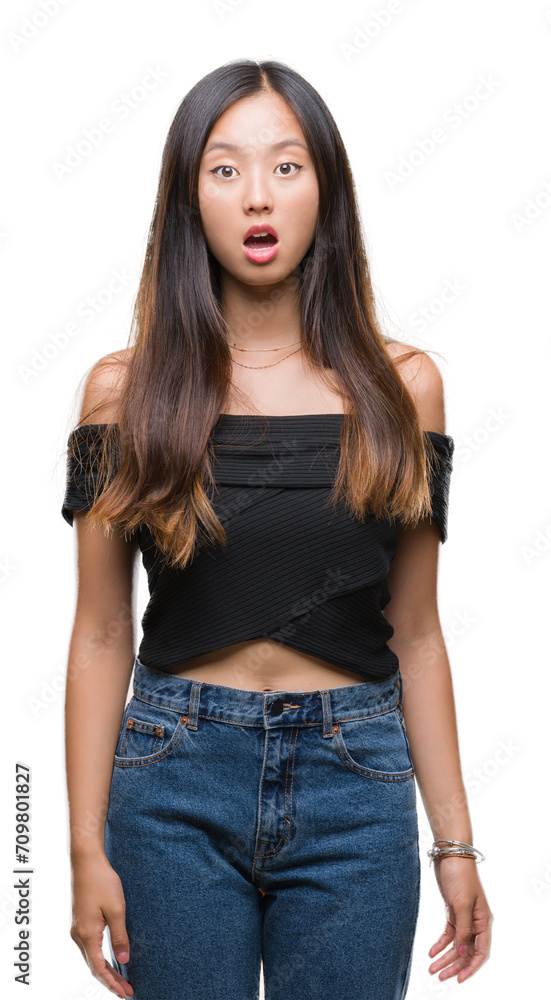 Young asian woman over isolated background afraid and shocked with surprise expression, fear and excited face. Young asian woman over isolated background afraid and shocked with surprise expression, fear and excited face.