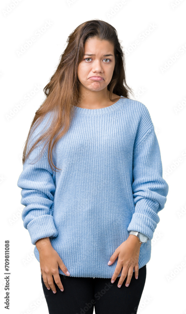 Young beautiful brunette woman wearing blue winter sweater over isolated background depressed and worry for distress, crying angry and afraid. Sad expression. Young beautiful brunette woman wearing blue winter sweater over isolated background depressed and worry for distress, crying angry and afraid. Sad expression.