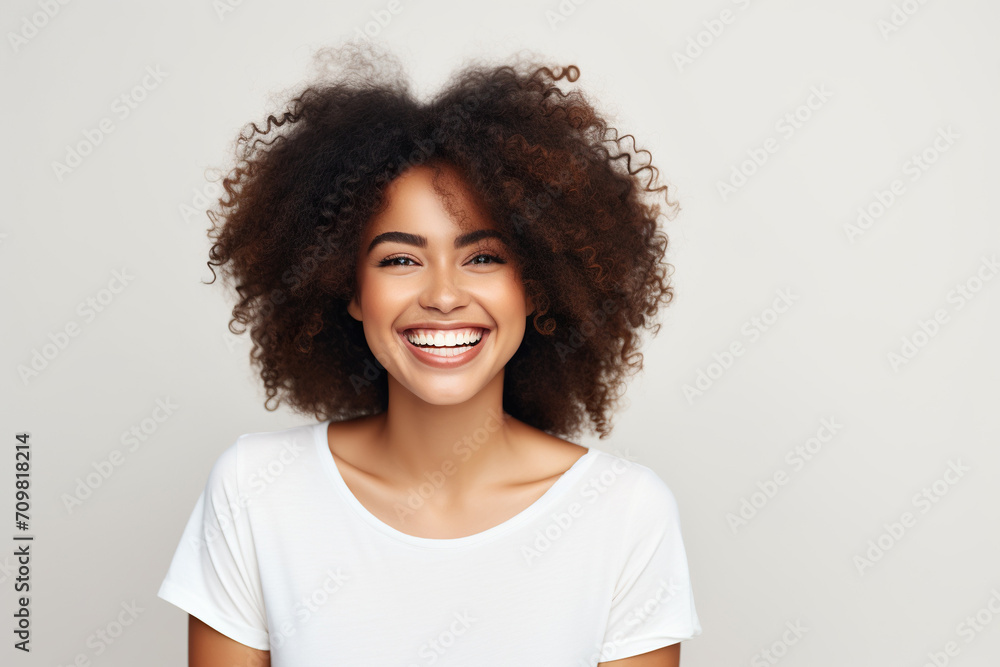 Black woman smiling in a studio