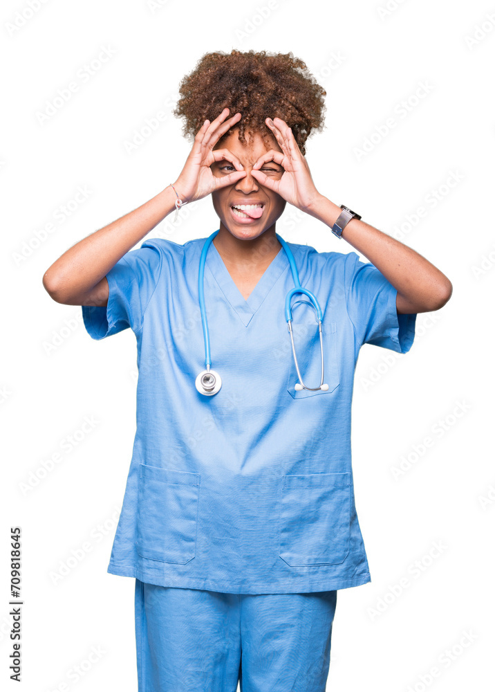 Young african american doctor woman over isolated background doing ok gesture like binoculars sticking tongue out, eyes looking through fingers. Crazy expression. Young african american doctor woman over isolated background doing ok gesture like binoculars sticking tongue out, eyes looking through fingers. Crazy expression.