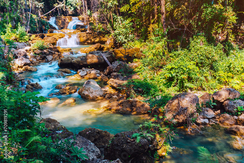 Beautiful of Huai mae khamin waterfall Srinakarin national park at Kanchanaburi thailand. Waterfall clear emerald water on autumn and summer season with rock for holiday relax on green tree in jungle.