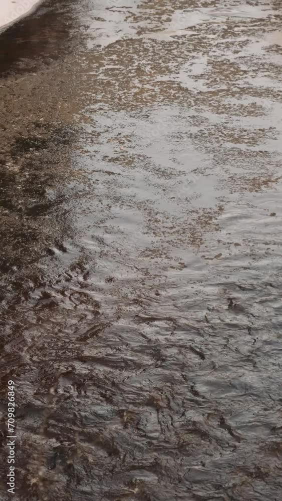 Natural River Water Flowing over Muddy Surface Natural River Water Flowing over Muddy Surface