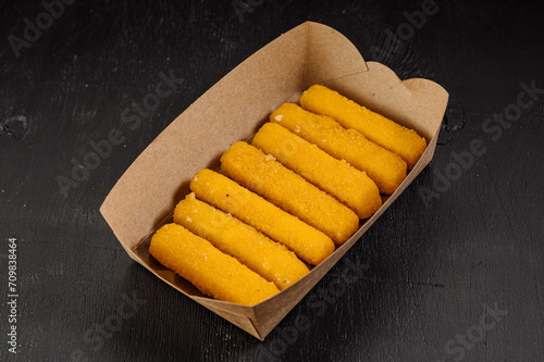 Delicious fast food golden fried nuggets in a cardboard box for takeaway