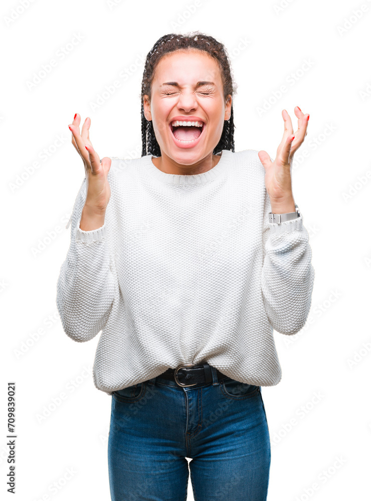 Young braided hair african american girl wearing winter sweater over isolated background celebrating mad and crazy for success with arms raised and closed eyes screaming excited. Winner concept Young braided hair african american girl wearing winter sweater over isolated background celebrating mad and crazy for success with arms raised and closed eyes screaming excited. Winner concept