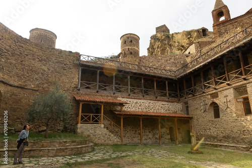 Woman tourist at David Gareja monastery religious complex in Georgia Azerbaijan border photo