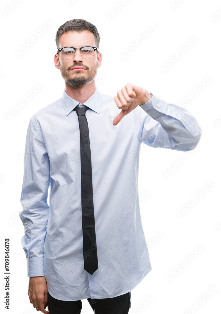 Young business man with angry face, negative sign showing dislike with thumbs down, rejection concept Young business man with angry face, negative sign showing dislike with thumbs down, rejection concept