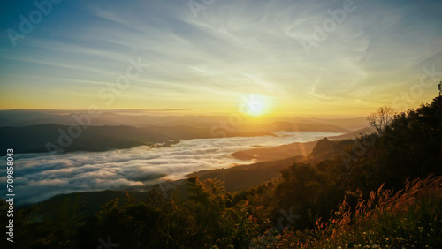 Morning fog at doi samer dao at Sri Nan national park  Thailand. Beautiful landscape Sea fog or sea of cloud view in the morning. Sunbeam in the mountains and mist.