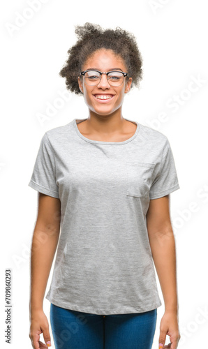 Young afro american woman wearing glasses over isolated background with a happy and cool smile on face. Lucky person.