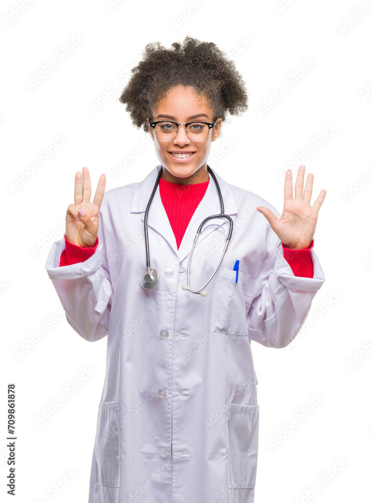 Young afro american doctor woman over isolated background showing and pointing up with fingers number eight while smiling confident and happy. Young afro american doctor woman over isolated background showing and pointing up with fingers number eight while smiling confident and happy.