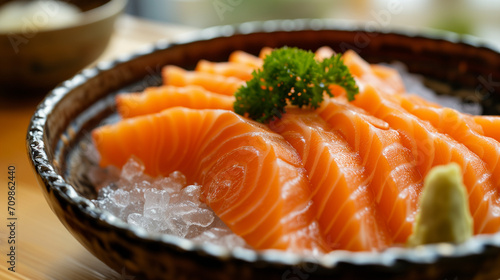 Salmon Sashimi in Japanese buffet restaurant menu. Fresh Sashimi fillet on black plate salmon slices.Asian Food Menu. Seafood sashimi. focus on salmon sliced on ice. Supermarket.