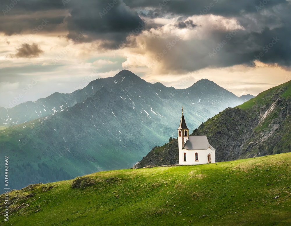 Minimalist landscape with small church in mountains and dramatic sky