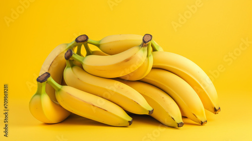 Ripe bananas radiate their sunny yellow