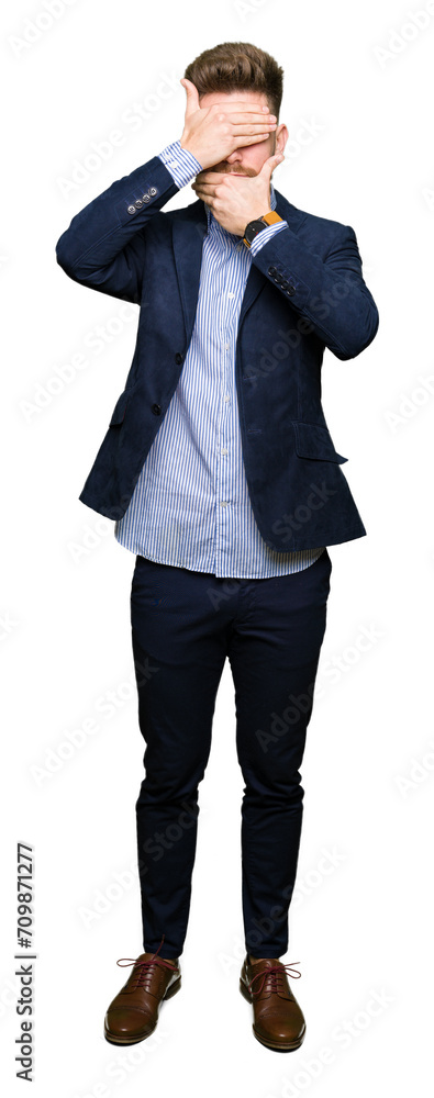 Young handsome bussines man Covering eyes and mouth with hands, surprised and shocked. Hiding emotion Young handsome bussines man Covering eyes and mouth with hands, surprised and shocked. Hiding emotion