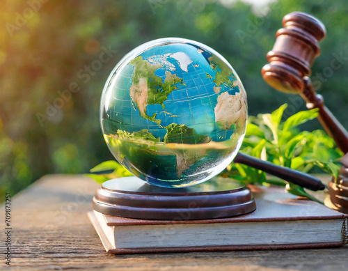 Environment Law. Globe Glass placed and gavel on a law book. law for principles of sustainable environmental conservation. environmental protection and eco-friendly legislation law. Save Earth
