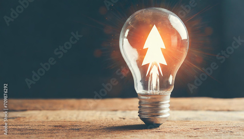Rocket launch idea inside lightbulb with arrows up. strategically planning and initiating a corporate startup. aim to achieve objectives through value development, fostering leadership
