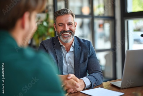 Happy middle aged mature business man hr manager, lawyer and client shake hands at office meeting interview making successful partnership agreement, financial bank deal with handshake, Generative AI