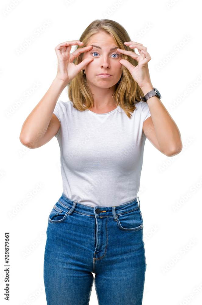 Beautiful young woman wearing casual white t-shirt over isolated background Trying to open eyes with fingers, sleepy and tired for morning fatigue Beautiful young woman wearing casual white t-shirt over isolated background Trying to open eyes with fingers, sleepy and tired for morning fatigue