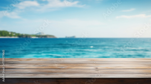 close-up of an empty wooden table and blurred ocean background  mockup background for product display