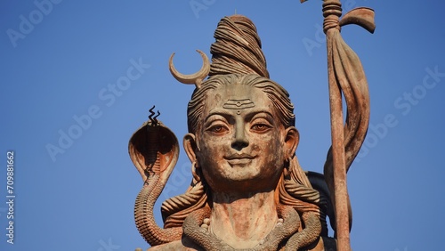 face statue of god shiv holding trishul photo