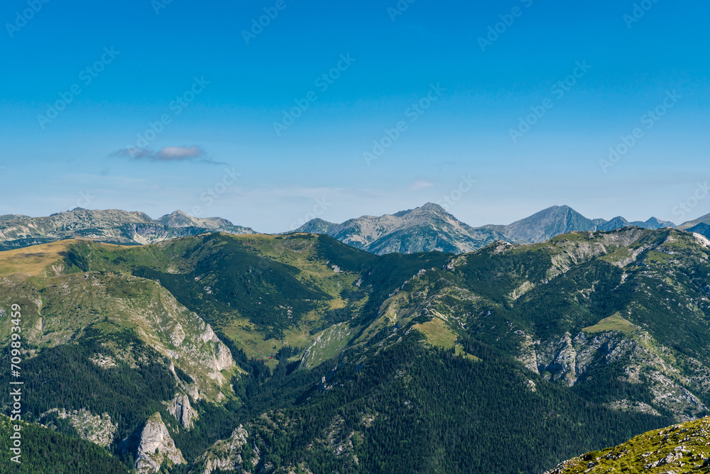 Retezat mountains from Cadea Oslei hill summit in Valcan mountains in Romania