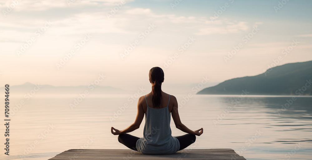 Woman practicing yoga by the sea, meditating outdoors. Meditation, healthy lifestyle, relaxation, yoga, self care, mindfulness concept Woman practicing yoga by the sea, meditating outdoors. Meditation, healthy lifestyle, relaxation, yoga, self care, mindfulness concept