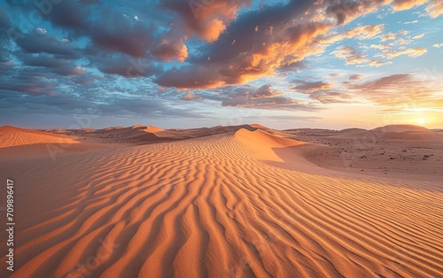 Sand dunes at sunset in the Wahiba Sands desert with clouds in the sky    Middle East