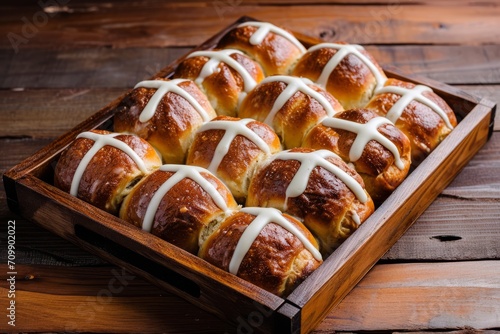 Arrangement of Hot Cross Buns on Plate. Hot cross buns arranged neatly on a plate, ready for Easter celebration.