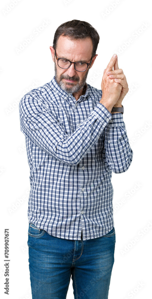 Handsome middle age elegant senior man wearing glasses over isolated background Holding symbolic gun with hand gesture, playing killing shooting weapons, angry face Handsome middle age elegant senior man wearing glasses over isolated background Holding symbolic gun with hand gesture, playing killing shooting weapons, angry face
