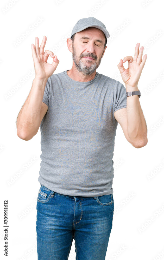 Handsome middle age hoary senior man wearing sport cap over isolated background relax and smiling with eyes closed doing meditation gesture with fingers. Yoga concept. Handsome middle age hoary senior man wearing sport cap over isolated background relax and smiling with eyes closed doing meditation gesture with fingers. Yoga concept.