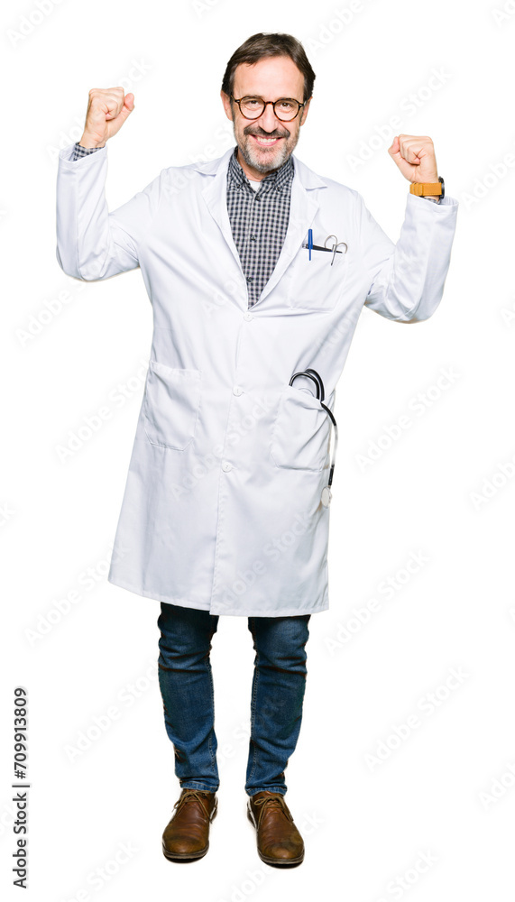 Middle age doctor men wearing medical coat showing arms muscles smiling proud. Fitness concept. Middle age doctor men wearing medical coat showing arms muscles smiling proud. Fitness concept.
