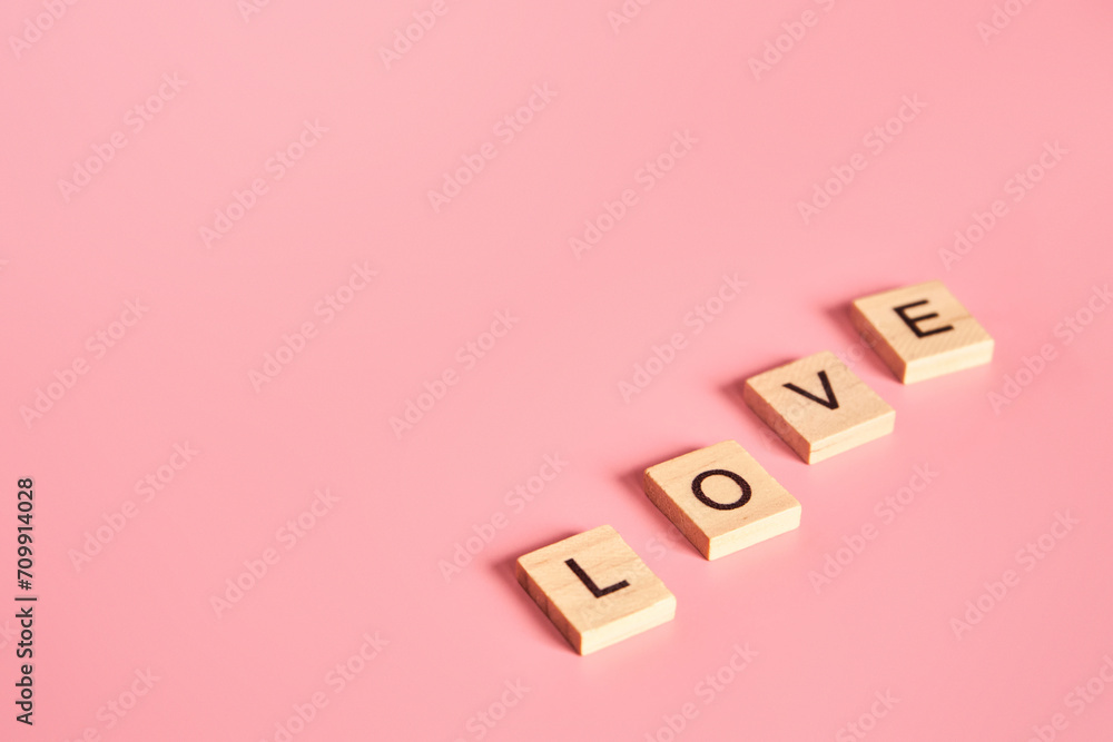 Letters of the English alphabet folded diagonally into the word love. Postcard concept with empty copy space. Letters of the English alphabet folded diagonally into the word love. Postcard concept with empty copy space.