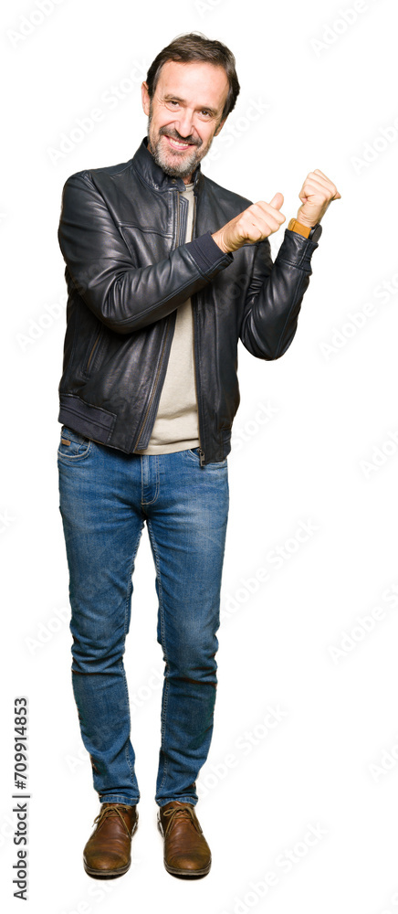 Middle age handsome man wearing black leather jacket Pointing to the back behind with hand and thumbs up, smiling confident Middle age handsome man wearing black leather jacket Pointing to the back behind with hand and thumbs up, smiling confident