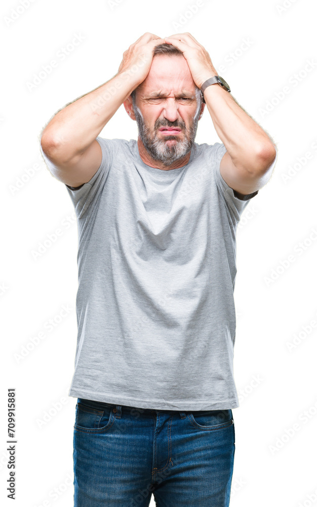 Middle age senior hoary man over isolated background suffering from headache desperate and stressed because pain and migraine. Hands on head. Middle age senior hoary man over isolated background suffering from headache desperate and stressed because pain and migraine. Hands on head.