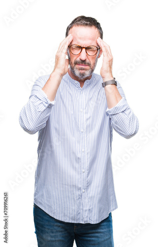 Middle age hoary senior man wearing glasses over isolated background with hand on head for pain in head because stress. Suffering migraine.