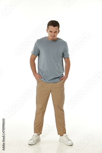 annoyed angry man shouting on white studio background