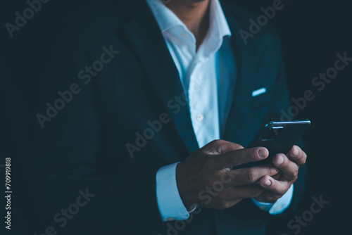 Businessman working on smartphone screen with free space to enter text for use.