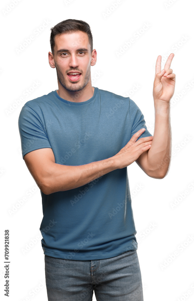 Handsome young casual man smiling with happy face winking at the camera doing victory sign. Number two. Handsome young casual man smiling with happy face winking at the camera doing victory sign. Number two.