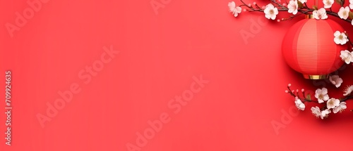 chinese lantern with white cherry blossoms isolated on a red wall, happy new year 2024 , year of dragon, horizontal background banner with copy space Chinese zodiac symbol, Lunar new year concept.