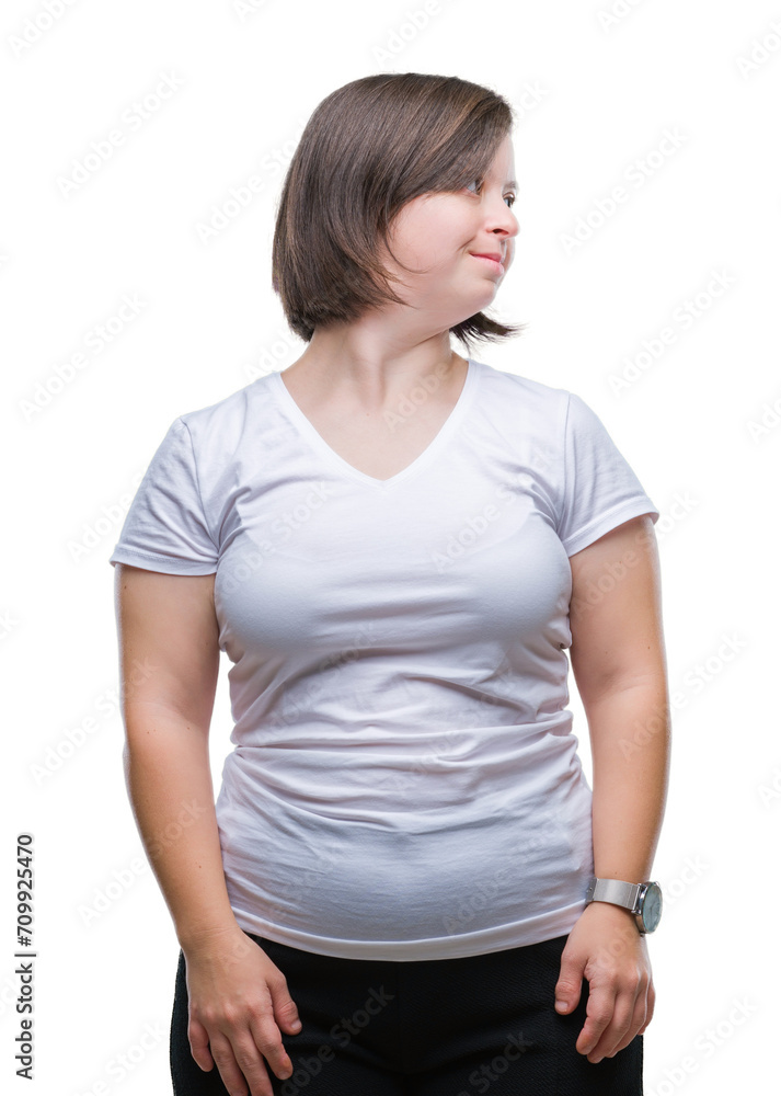 Young adult woman with down syndrome over isolated background looking away to side with smile on face, natural expression. Laughing confident.