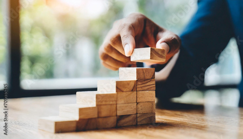 Business growth success achievement concept, arranging wooden block stacking as step stair or ladder for planning development leadership and customer target group concept.