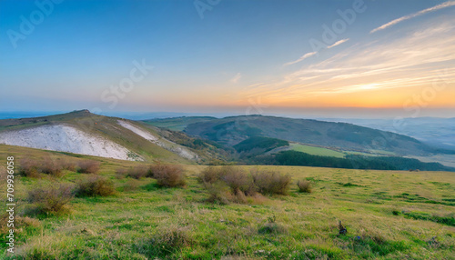 colorful HDR landscape at sunset, blue sky and white mountains