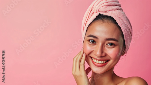 Beauty skin. Head and shoulders of asian indonesian woman model, touching glowing, hydrated facial skin, apply toner, skin cream or lotion for healthy look, after shower portrait, white background. photo
