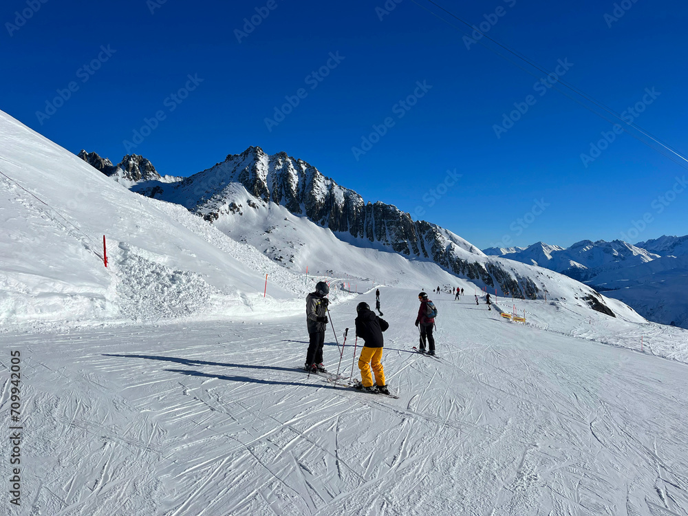 skiers on the top of mountain
