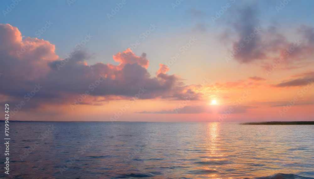 Sunset sky panorama with bright glowing pink Cumulus clouds. sun above the sea water